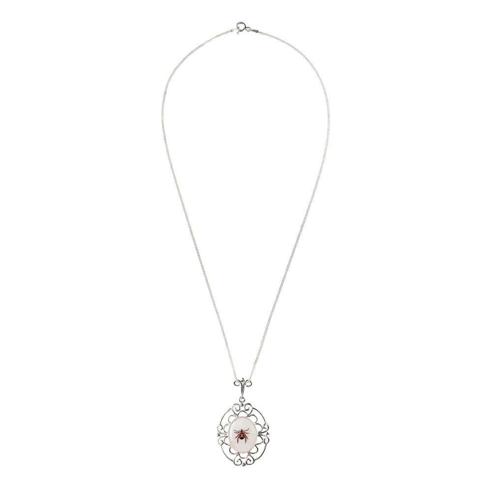 Necklace with a decorative pendant on a white background
