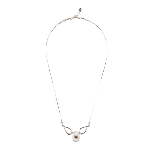 Silver necklace with a pendant on a white background
